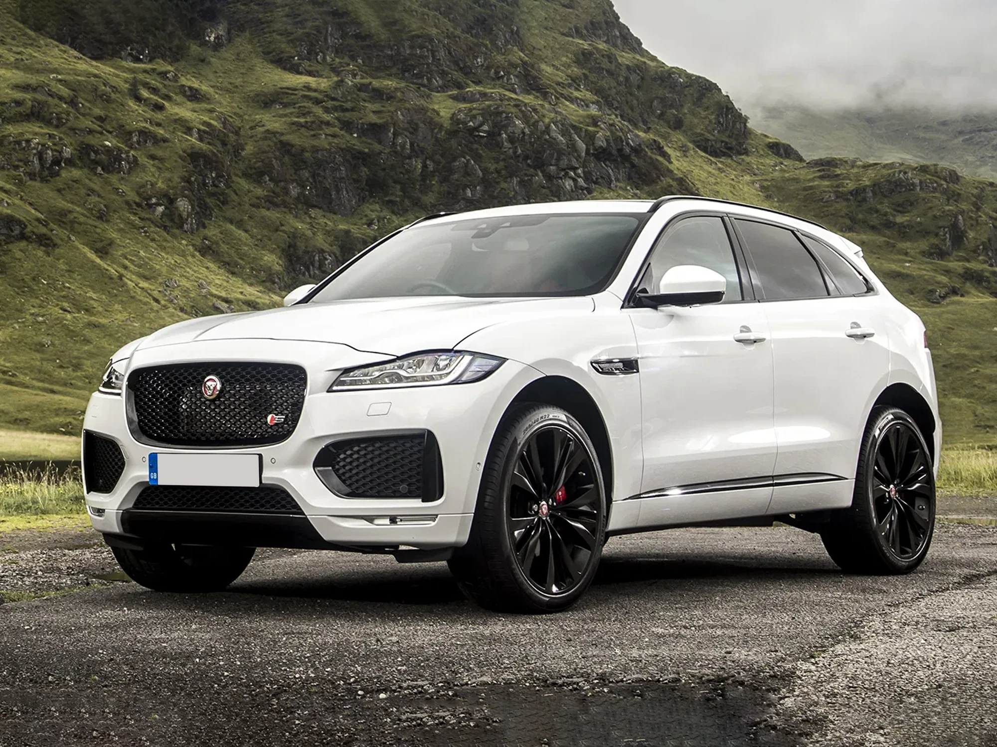 White Jaguar F-Pace on the road — we buy every model, in any condition